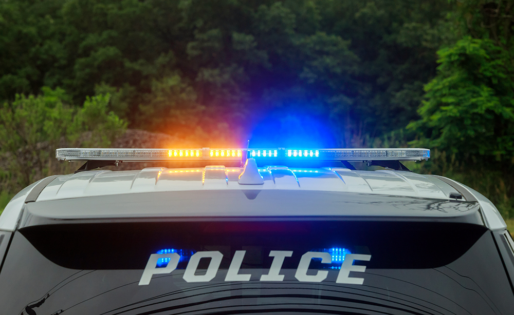 Police blue and red flashing light on the car in the street