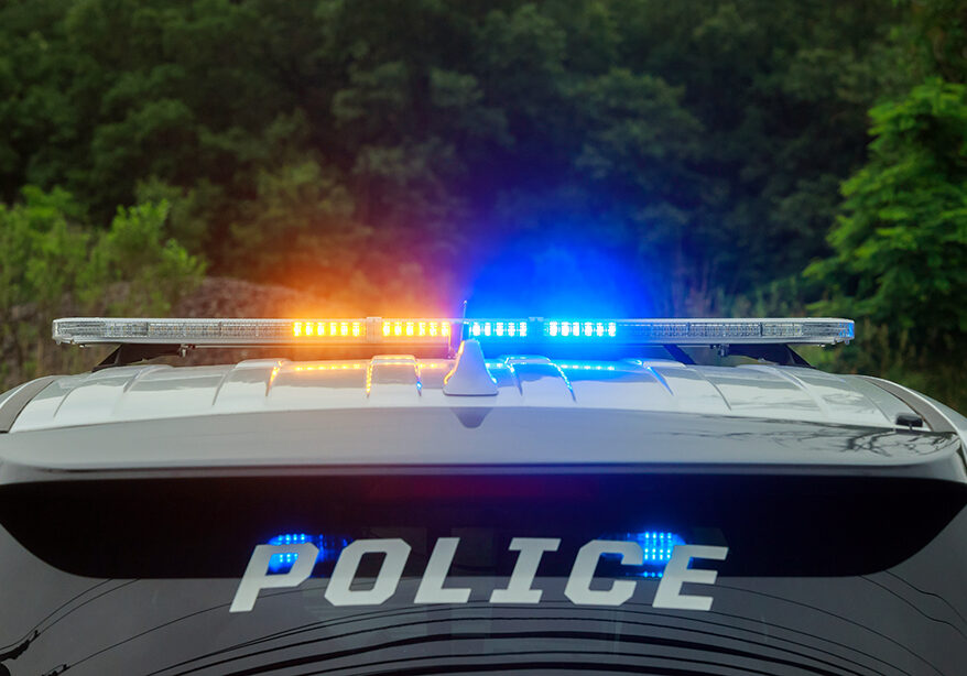 Police blue and red flashing light on the car in the street